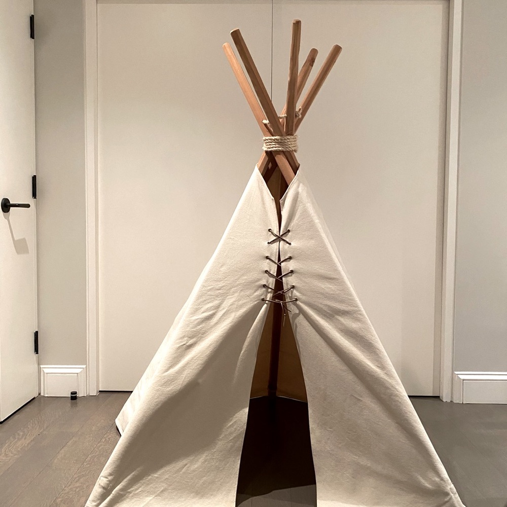 Kids white teepee with leather thread stitching.